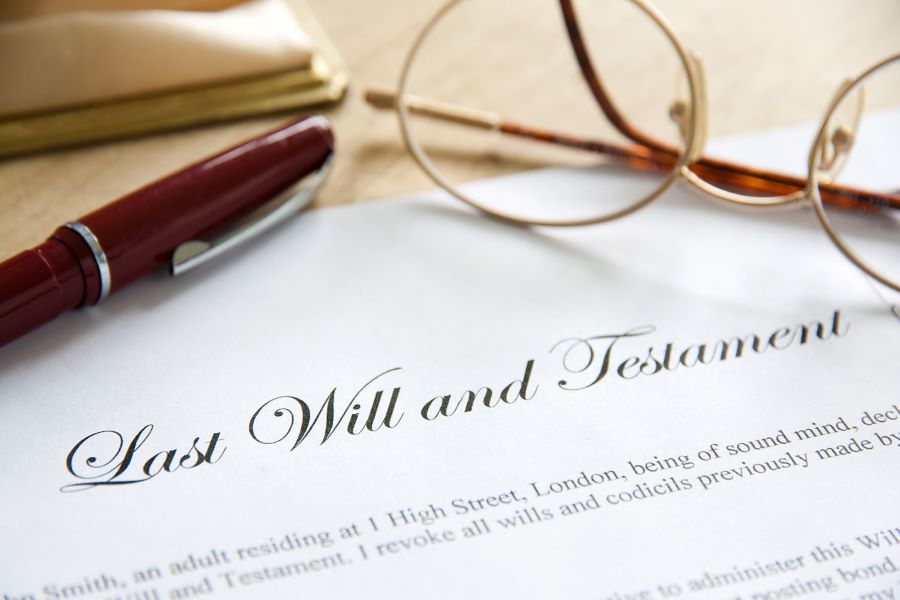 Last will and testament document with pen and seal for probate and estate discovery investigations by Stryker Investigations