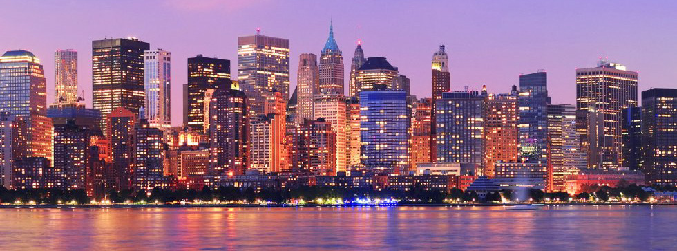 Manhattan Skyline At Sunset Viewed From Jersey City, Featuring One World Trade Center, Empire State Building, And The Financial District'S Skyscrapers Reflected In New York Harbor